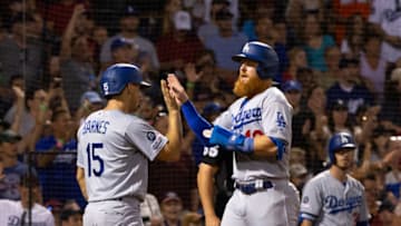 BOSTON, MA - JULY 13: Austin Barnes #15 of the Los Angeles Dodgers and teammate Justin Turner #10 celebrate at home plate after scoring on teammate David Freese #25 two-run double against the Boston Red Sox during the fifth inning at Fenway Park on July 13, 2019 in Boston, Massachusetts. (Photo by Rich Gagnon/Getty Images)