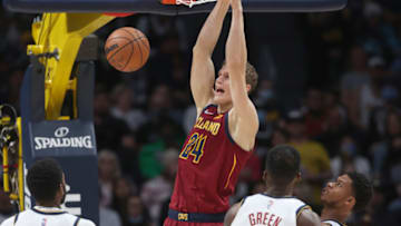 DENVER, COLORADO - OCTOBER 25: Lauri Markkanen #24 of the Cleveland Cavaliers dunks the ball against JaMychal Green #0 and Jeff Green #32 of the Denver Nuggets in the fourth quarter at Ball Arena on October 25, 2021 in Denver, Colorado. NOTE TO USER: User expressly acknowledges and agrees that, by downloading and or using this photograph, User is consenting to the terms and conditions of the Getty Images License Agreement (Photo by Matthew Stockman/Getty Images)