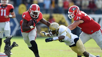 Nov 28, 2015; Atlanta, GA, USA; Georgia Bulldogs running back Keith Marshall (4) runs against Georgia Tech Yellow Jackets defensive back Jamal Golden (4) during the second half at Bobby Dodd Stadium. Georgia defeated Georgia Tech 13-7. Mandatory Credit: Dale Zanine-USA TODAY Sports