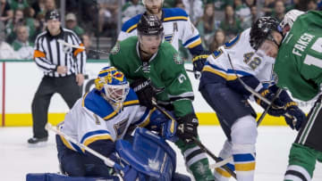 May 7, 2016; Dallas, TX, USA; St. Louis Blues goalie Brian Elliott (1) defends Dallas Stars left wing Antoine Roussel (21) during the second period in game five of the second round of the 2016 Stanley Cup Playoffs at American Airlines Center. Mandatory Credit: Jerome Miron-USA TODAY Sports