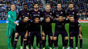(FromL) Barcelona's players: (front row) German goalkeeper Marc-Andre Ter Stegen, French defender Samuel Umtiti, Portuguese midfielder Andre Gomes, Croatian midfielder Ivan Rakitic, midfielder Sergio Busquets, defender Gerard Pique and (front row) Argentinian forward Lionel Messi, Brazilian forward Neymar, midfielder Sergi Roberto, Uruguayan forward Luis Suarez and defender Jordi Alba pose before the Spanish league football match RCD Espanyol vs FC Barcelona at the Cornella-El Prat stadium in Cornella de Llobregat on April 29, 2017.Barcelona won 3-0. / AFP PHOTO / PAU BARRENA (Photo credit should read PAU BARRENA/AFP/Getty Images)