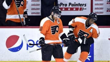 Mar 3, 2016; Philadelphia, PA, USA; Philadelphia Flyers center Claude Giroux (28) and right wing Wayne Simmonds (17) skate off the ice after loss to Edmonton Oilers at Wells Fargo Center. The Oilers defeated the Flyers, 4-0. Mandatory Credit: Eric Hartline-USA TODAY Sports