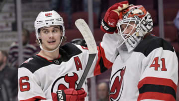 Nov 15, 2022; Montreal, Quebec, CAN; New Jersey Devils forward Jack Hughes (86) celebrates the win over the Montreal Canadiens with teammate goalie Vitek Vanecek (41) at the Bell Centre. Mandatory Credit: Eric Bolte-USA TODAY Sports