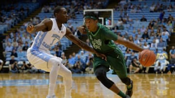 CHAPEL HILL, NC - DECEMBER 16: Melvin Frazier #35 of the Tulane Green Wave drives against Theo Pinson #1 of the North Carolina Tar Heels during their game at the Dean Smith Center on December 16, 2015 in Chapel Hill, North Carolina. North Carolina won 96-72. (Photo by Grant Halverson/Getty Images)