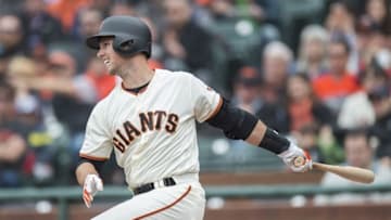 Apr 10, 2016; San Francisco, CA, USA; San Francisco Giants catcher Buster Posey (28) hits a single to right field during the first inning against the Los Angeles Dodgers at AT&T Park. Mandatory Credit: Kenny Karst-USA TODAY Sports