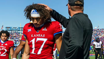 Oct 8, 2022; Lawrence, Kansas, USA; Kansas Jayhawks quarterback Jason Bean (17) is consoled by head coach Lance Leipold after losing to the TCU Horned Frogs at David Booth Kansas Memorial Stadium. Mandatory Credit: Jay Biggerstaff-USA TODAY Sports