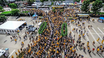 Sep 3, 2016; Iowa City, IA, USA; Fans line the streets as the Iowa Hawkeyes arrive for their game against the Miami (Oh) Redhawks at Kinnick Stadium. Mandatory Credit: Jeffrey Becker-USA TODAY Sports