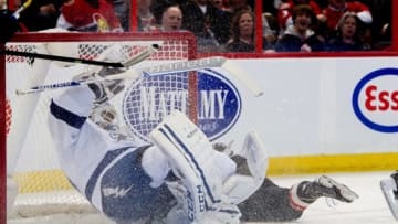 Jan 30, 2014; Ottawa, Ontario, CAN; Tampa Bay Lightning goalie Anders Lindback (39) is ran into by Ottawa Senators left wing Croy Conacher (89) in the second period at the Canadian Tire Centre. Mandatory Credit: Marc DesRosiers-USA TODAY Sports