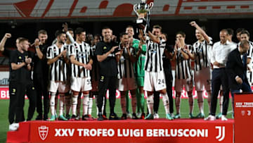 Daniele Rugani of Juventus FC lifts the Luig Berlusconi trophy at the end of the AC Monza v Juventus FC - Trofeo Berlusconi at Stadio Brianteo on July 31, 2021 in Monza, Italy. (Photo by Marco Luzzani/Getty Images)
