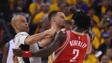 April 16, 2016; Oakland, CA, USA; Golden State Warriors guard Stephen Curry (30, center) and Houston Rockets guard Patrick Beverley (2) are separated by NBA official Dan Crawford (left) during the first quarter in game one of the first round of the NBA Playoffs at Oracle Arena. Mandatory Credit: Kyle Terada-USA TODAY Sports