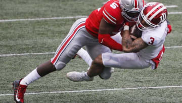 Ohio State Buckeyes linebacker Baron Browning (5) hits Indiana Hoosiers wide receiver Ty Fryfogle (3) during the first quarter of a NCAA Division I football game between the Ohio State Buckeyes and the Indiana Hoosiers on Saturday, Nov. 21, 2020 at Ohio Stadium in Columbus, Ohio.Cfb Indiana Hoosiers At Ohio State Buckeyes