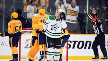 Mar 8, 2022; Nashville, Tennessee, USA; Dallas Stars center Roope Hintz (24) skates off as Nashville Predators players celebrate following a win at Bridgestone Arena. Mandatory Credit: Christopher Hanewinckel-USA TODAY Sports