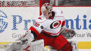 NEWARK, NJ - DECEMBER 09: Cam Ward #30 of the Carolina Hurricanes defends against the New Jersey Devils on December 9, 2009 in Newark, New Jersey. (Photo by Paul Bereswill/Getty Images)