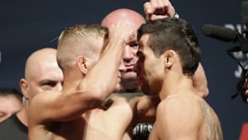 Jul 24, 2015; Chicago, IL, USA; TJ Dillashaw left and Renan Barao right during weigh ins for UFC Fight Night at United Center. Mandatory Credit: Kamil Krzaczynski-USA TODAY Sports