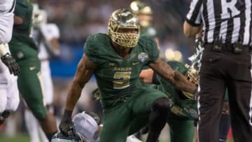 Jan 1, 2015; Arlington, TX, USA; Baylor Bears defensive end Shawn Oakman (2) celebrates his sack of Michigan State Spartans quarterback Connor Cook (18) during the first half in the 2015 Cotton Bowl Classic at AT&T Stadium. Mandatory Credit: Jerome Miron-USA TODAY Sports