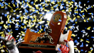 ATLANTA, GA - DECEMBER 5: Alabama Crimson Tide raise the trophy into the air after defeating the Florida Gators 29-15 in the SEC Championship game at the Georgia Dome on December 5, 2015 in Atlanta, Georgia. (Photo by Kevin C. Cox/Getty Images)