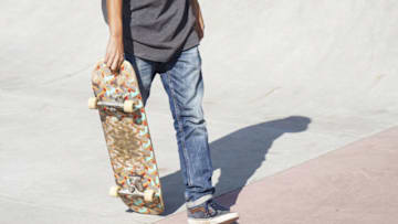SAN SALVADOR , EL SALVADOR - OCTOBER 03: A Salvadoran holds a skateboard at a skate park at "La Zacamil" in San Salvador, El Salvador, on October 3, 2022. Through skateboarding, young people from violently devastated communities hope to transform their way of life. El Salvador fights to eliminate the gangs. And a number of young people attempt to flee from the cruelest and most vicious gangs in the world by participating in sports. Every year, the birth anniversary of Mahatma Gandhi, a hero of India's struggle for independence, coincides with the International Day Of Nonviolence. (Photo by Alex Pena/Anadolu Agency via Getty Images)