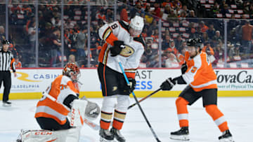 PHILADELPHIA, PA - DECEMBER 17: Carter Hart #79 of the Philadelphia Flyers makes a save behind a camping Derek Grant #38 of the Anaheim Ducks as Ivan Provorov #9 of the Philadelphia Flyers defends in the first period at Wells Fargo Center on December 17, 2019 in Philadelphia, Pennsylvania. (Photo by Drew Hallowell/Getty Images)