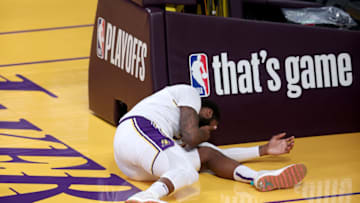 LOS ANGELES, CALIFORNIA - MAY 30: Andre Drummond #2 of the Los Angeles Lakers lands hard after defending a shot during the second half of Game Four of the Western Conference first-round playoff series against the Phoenix Suns at Staples Center on May 30, 2021 in Los Angeles, California. NOTE TO USER: User expressly acknowledges and agrees that, by downloading and or using this photograph, User is consenting to the terms and conditions of the Getty Images License Agreement. (Photo by Sean M. Haffey/Getty Images)