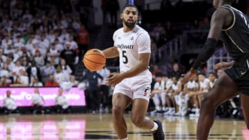 Cincinnati Bearcats guard David DeJulius controls the ball against the UCF Knights at Fifth Third Arena. USA Today.