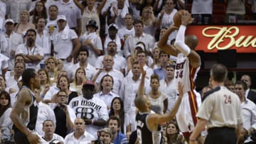 Ray Allen (R) of the Miami Heat shoots a three-pointer before Tony Parker (2nd-R) of the San Antonio Spurs to tie the game with five seconds remaining in regrlar time during Game 6 of the NBA Finals at the American Airlines Arena June 19, 2013 in Miami, Florida. Miami defeated San Antonio 103-100 in overtime to even the best-of-seven championship series 3-3. AFP PHOTO / Brendan SMIALOWSKI (Photo credit should read BRENDAN SMIALOWSKI/AFP/Getty Images)