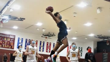 Menomonee Falls guard Seth Trimble throws down a dunk against Marquette during a game on Dec. 2, 2020.Rs5a5198