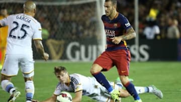 July 21, 2015; Los Angeles, CA, USA; Barcelona forward Sandro Ramirez (19) controls the ball against Los Angeles Galaxy midfielder Robbie Rogers (14) and goalkeeper Jordi Masip (25) during the second half at Rose Bowl. Mandatory Credit: Gary A. Vasquez-USA TODAY Sports