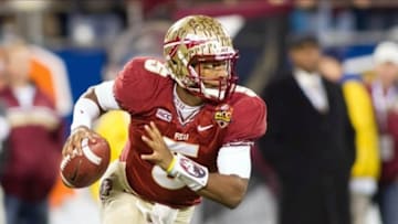 Dec 7, 2013; Charlotte, NC, USA; Florida State Seminoles quarterback Jameis Winston (5) runs the ball during the first quarter against the Duke Blue Devils at Bank of America Stadium. Mandatory Credit: Jeremy Brevard-USA TODAY Sports