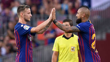Barcelona's Chilean midfielder Arturo Vidal (R) replaces Barcelona's Croatian midfielder Ivan Rakitic during the Spanish league football match between FC Barcelona and SD Huesca at the Camp Nou stadium in Barcelona on September 2, 2018. (Photo by LLUIS GENE / AFP) (Photo credit should read LLUIS GENE/AFP/Getty Images)