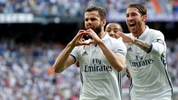 MADRID, SPAIN - MAY 14: Nacho Fernandez of Real Madrid celebrates with his teammates Sergio Ramos and Danilo after scoring the opening goal during the La Liga match between Real Madrid CF and Sevilla CF at Estadio Santiago Bernabeu on May 14, 2017 in Madrid, Spain. (Photo by TF-Images/Getty Images)