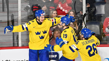 HALIFAX, CANADA - JANUARY 05: Oskar Pettersson #27 of Team Sweden celebrates his goal with teammates Isak Rosen #19 and Victor Stjernborg #26 during the second period against Team United States in the bronze medal round of the 2023 IIHF World Junior Championship at Scotiabank Centre on January 5, 2023 in Halifax, Nova Scotia, Canada. (Photo by Minas Panagiotakis/Getty Images)