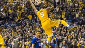 Jan 12, 2016; Morgantown, WV, USA; West Virginia Mountaineers guard Jaysean Paige (5) dunks the ball at the end of regulation to beat the Kansas Jayhawks at the WVU Coliseum. Mandatory Credit: Ben Queen-USA TODAY Sports