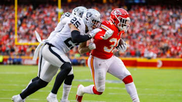 KANSAS CITY, MO - DECEMBER 01: Darrel Williams #31 of the Kansas City Chiefs beats the tackle of Erik Harris #25 of the Oakland Raiders for a first quarter touchdown reception at Arrowhead Stadium on December 1, 2019 in Kansas City, Missouri. (Photo by David Eulitt/Getty Images)