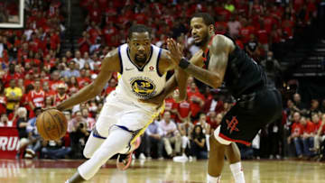 HOUSTON, TX - MAY 28: Kevin Durant #35 of the Golden State Warriors drives against Trevor Ariza #1 of the Houston Rockets in the third quarter of Game Seven of the Western Conference Finals of the 2018 NBA Playoffs at Toyota Center on May 28, 2018 in Houston, Texas. NOTE TO USER: User expressly acknowledges and agrees that, by downloading and or using this photograph, User is consenting to the terms and conditions of the Getty Images License Agreement. (Photo by Ronald Martinez/Getty Images)