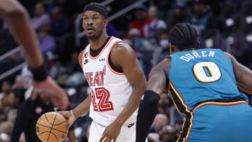 Apr 4, 2023; Detroit, Michigan, USA; Miami Heat forward Jimmy Butler (22) dribbles defended by Detroit Pistons center Jalen Duren (0) in the first half at Little Caesars Arena. Mandatory Credit: Rick Osentoski-USA TODAY Sports