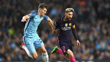 Lionel Messi and John Stones, Manchester City vs Barcelona (Photo by Shaun Botterill/Getty Images)