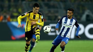 DORTMUND, GERMANY - OCTOBER 14: Mikel Morino of Dortmund is challenged by Sami Allagui of Hertha Berlin during the Bundesliga match between Borussia Dortmund and Hertha BSC at Signal Iduna Park on October 14, 2016 in Dortmund, Germany. (Photo by Lars Baron/Bongarts/Getty Images)
