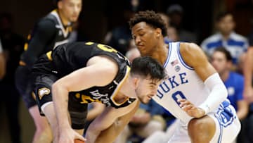 DURHAM, NORTH CAROLINA - NOVEMBER 29: Chandler Vaudrin #52 of the Winthrop Eagles tries to move away from the defense of Wendell Moore Jr. #0 of the Duke Blue Devils at Cameron Indoor Stadium on November 29, 2019 in Durham, North Carolina. (Photo by Bob Leverone/Getty Images)