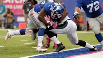 Oct 6, 2013; East Rutherford, NJ, USA; New York Giants running back David Wilson (22) scores a touchdown against the Philadelphia Eagles in the first quarter during the game at MetLife Stadium. Mandatory Credit: Robert Deutsch-USA TODAY Sports