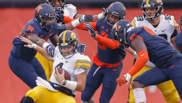 CHAMPAIGN, IL - NOVEMBER 17: Nate Stanley #4 of the Iowa Hawkeyes goes down for the sack at the hands of Owen Carney Jr. #99 and Del'Shawn Phillips #3 of the Illinois Fighting Illini at Memorial Stadium on November 17, 2018 in Champaign, Illinois. (Photo by Michael Hickey/Getty Images)