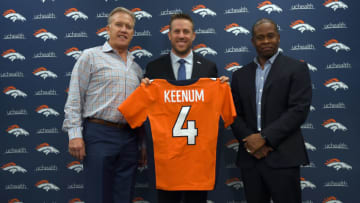 ENGLEWOOD, CO MARCH 16: John Elway, general manager and executive vice president of football operations of the Denver Broncos and head coach Vance Joseph present quarterback Case Keenum with his jersey with the no.4 on it during a press conference on March 16, 2018 at Dove Valley. Case Keenum agreed to terms on a two-year deal with the Denver Broncos. (Photo by John Leyba/The Denver Post via Getty Images)