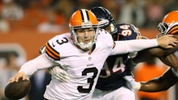 Aug 28, 2014; Cleveland, OH, USA; Cleveland Browns quarterback Rex Grossman (3) is hit by Chicago Bears defensive end Cornelius Washington (94)during the third quarter at FirstEnergy Stadium. Mandatory Credit: Ron Schwane-USA TODAY Sports