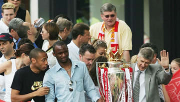 LONDON - MAY 16: Thierry Henry (L-R), Patrick Vieira and Arsene Wenger are seen at the front of the bus outside the Islington Town Hall during the Arsenal Football Club victory parade to show the League Champions with their FA Barclaycard Premiership Trophy on May 16, 2004 in Highbury, London. (Photo by Clive Mason/Getty Images)