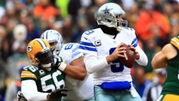Jan 11, 2015; Green Bay, WI, USA;Dallas Cowboys quarterback Tony Romo (9) is pressured by Green Bay Packers outside linebacker Julius Peppers (56) in the first quarter in the 2014 NFC Divisional playoff football game at Lambeau Field. Mandatory Credit: Andrew Weber-USA TODAY Sports