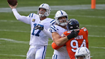 CHICAGO, ILLINOIS - OCTOBER 04: Philip Rivers #17 of the Indianapolis Colts passes as Anthony Castonzo #74 blocks Robert Quinn #94 of the Chicago Bears at Soldier Field on October 04, 2020 in Chicago, Illinois. (Photo by Jonathan Daniel/Getty Images)