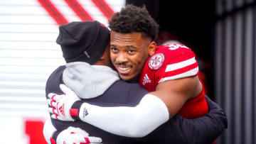 Nebraska Cornhuskers defensive end Ochaun Mathis (32) hugs Nebraska Cornhuskers interim head coach Mickey Joseph (Dylan Widger-USA TODAY Sports)