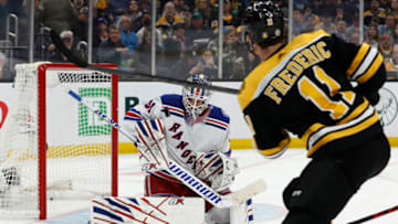 Apr 23, 2022; Boston, Massachusetts, USA; New York Rangers goaltender Igor Shesterkin (31) makes a save on Boston Bruins center Trent Frederic (11) during the second period at TD Garden. Mandatory Credit: Winslow Townson-USA TODAY Sports