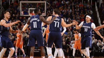 PHOENIX, AZ - NOVEMBER 29: The Dallas Mavericks high five each other during the game against the Phoenix Suns on November 29, 2019 at Talking Stick Resort Arena in Phoenix, Arizona. NOTE TO USER: User expressly acknowledges and agrees that, by downloading and or using this photograph, user is consenting to the terms and conditions of the Getty Images License Agreement. Mandatory Copyright Notice: Copyright 2019 NBAE (Photo by Barry Gossage/NBAE via Getty Images)