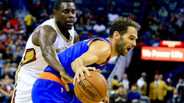Mar 28, 2016; New Orleans, LA, USA; New Orleans Pelicans guard Jrue Holiday (11) defends New York Knicks guard Jose Calderon (3) during the first quarter of a game at the Smoothie King Center. Mandatory Credit: Derick E. Hingle-USA TODAY Sports