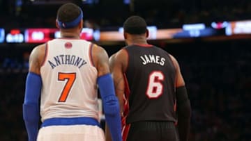 Feb 1, 2014; New York, NY, USA; New York Knicks small forward Carmelo Anthony (7) and Miami Heat small forward LeBron James (6) stand side by side during the fourth quarter of a game at Madison Square Garden. The Heat defeated the Knicks 106-91. Mandatory Credit: Brad Penner-USA TODAY Sports